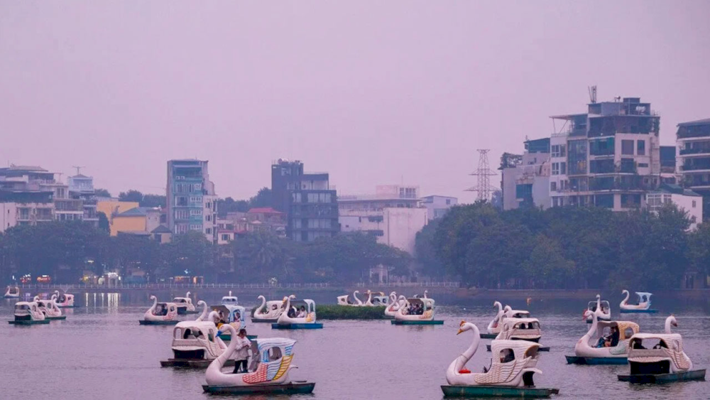 Experience pedal boating on a peaceful afternoon at Truc Bach Lake